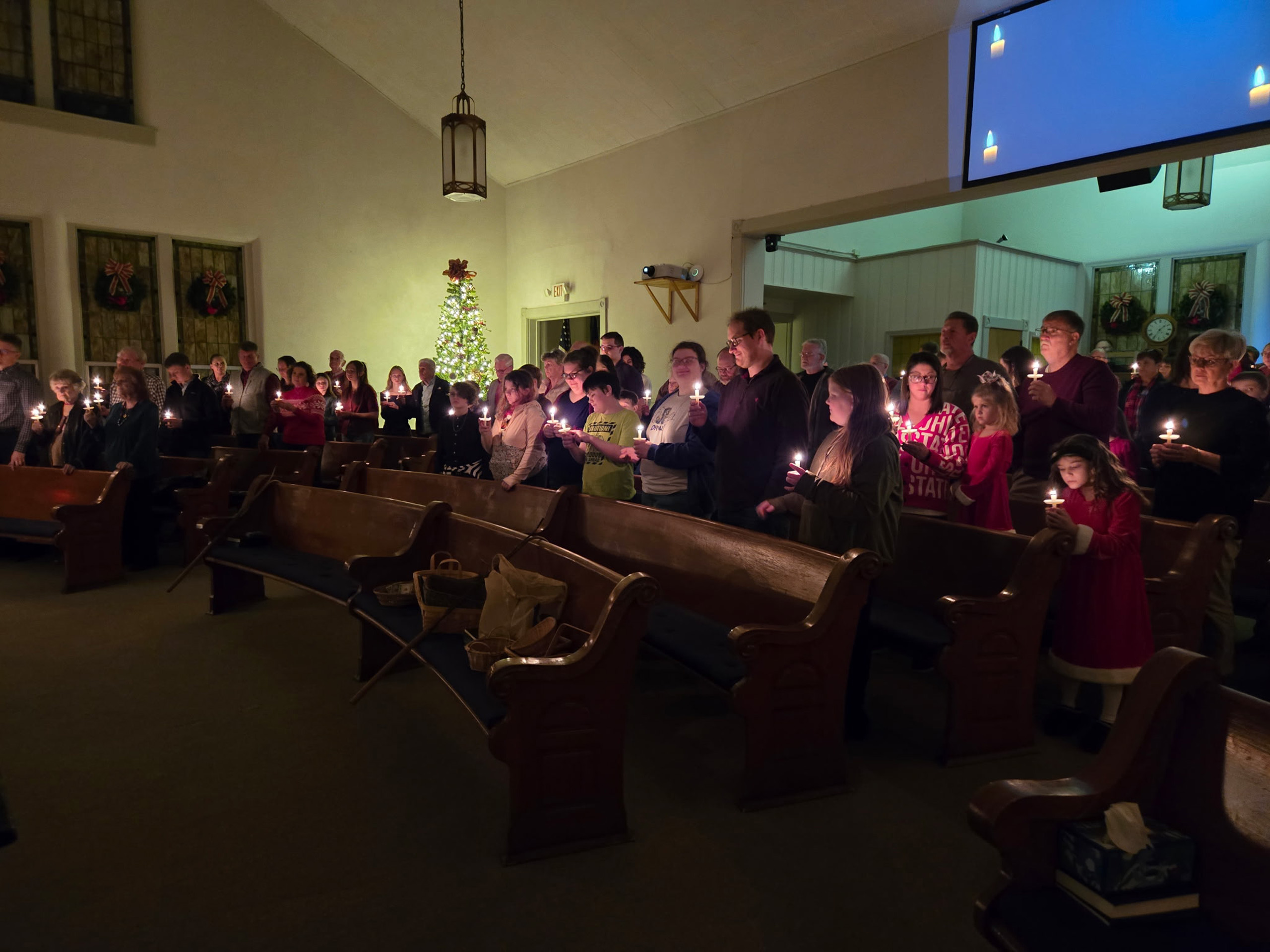 Congregation at candlelight service in church
