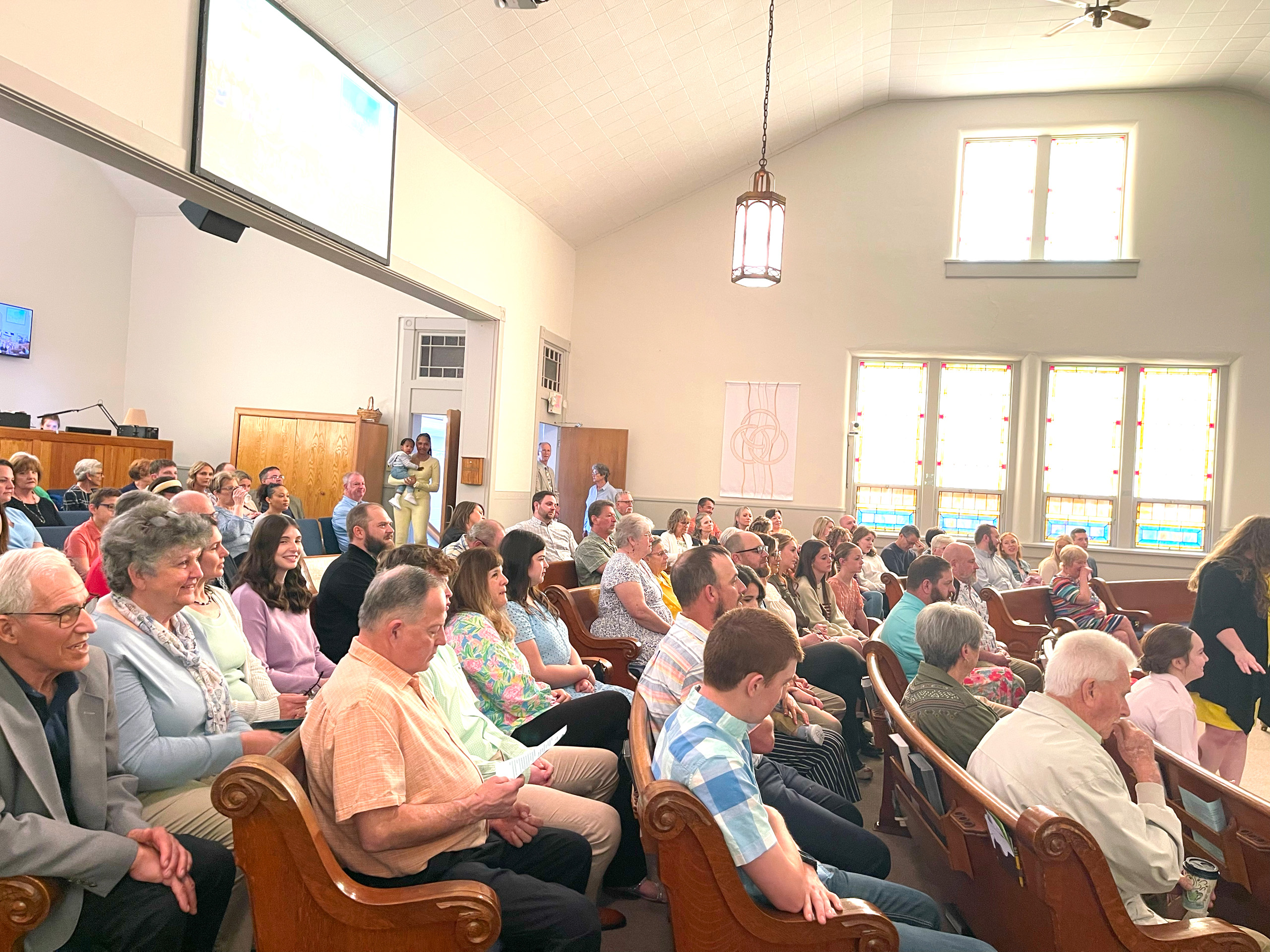Large congregation in pews at church