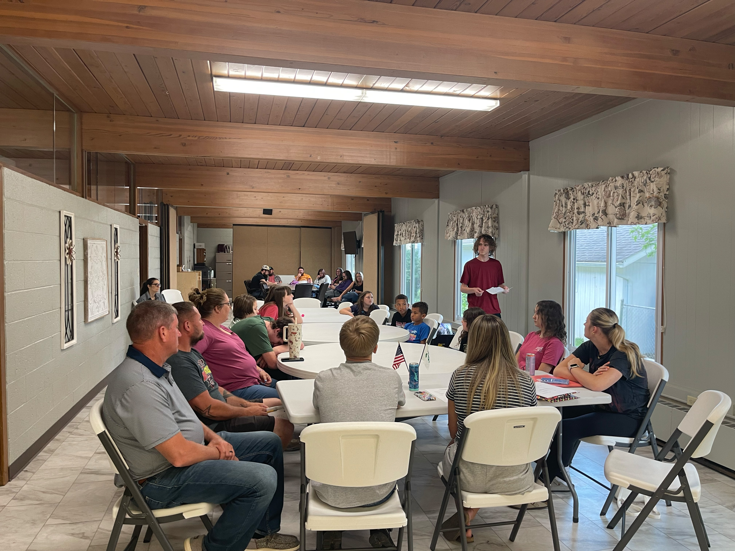 Group of people gathered around a large table