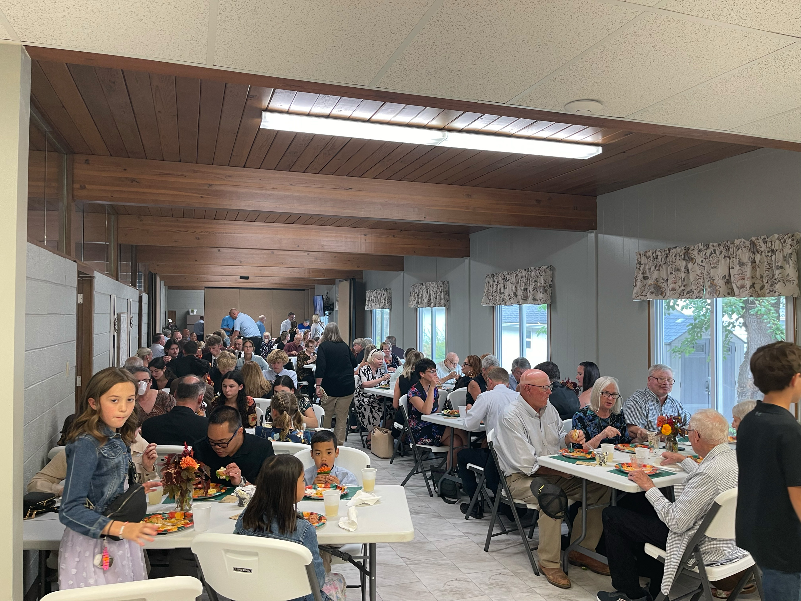 Community dinner in large room at Farmersville United Methodist Church
