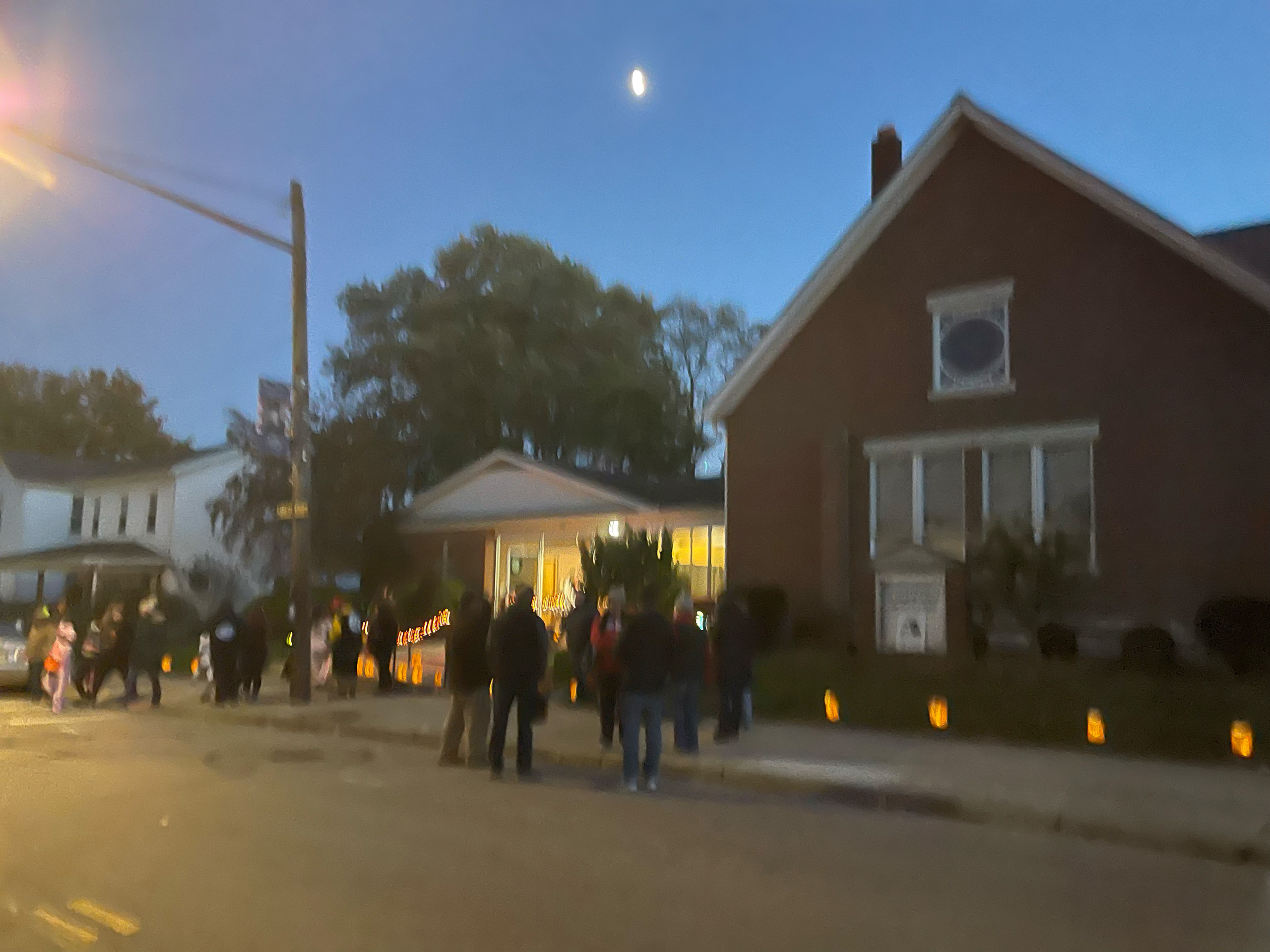 Group of people socializing in the evening outside of church