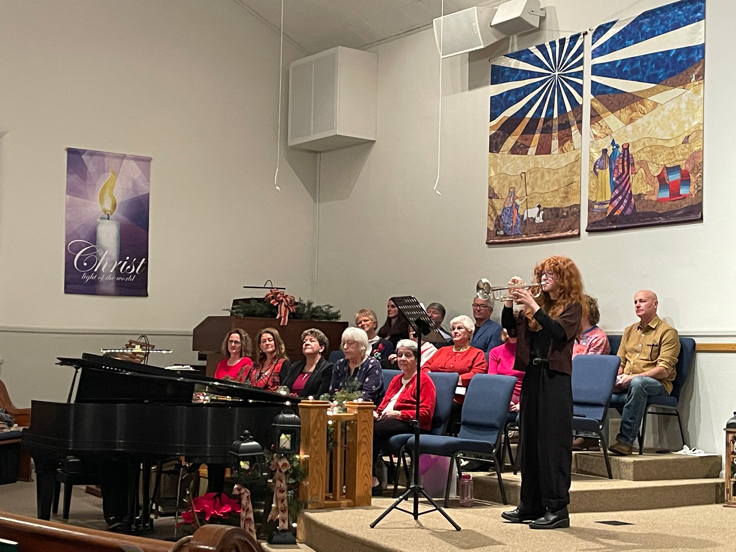 Trumpet player performs at a holiday church service.