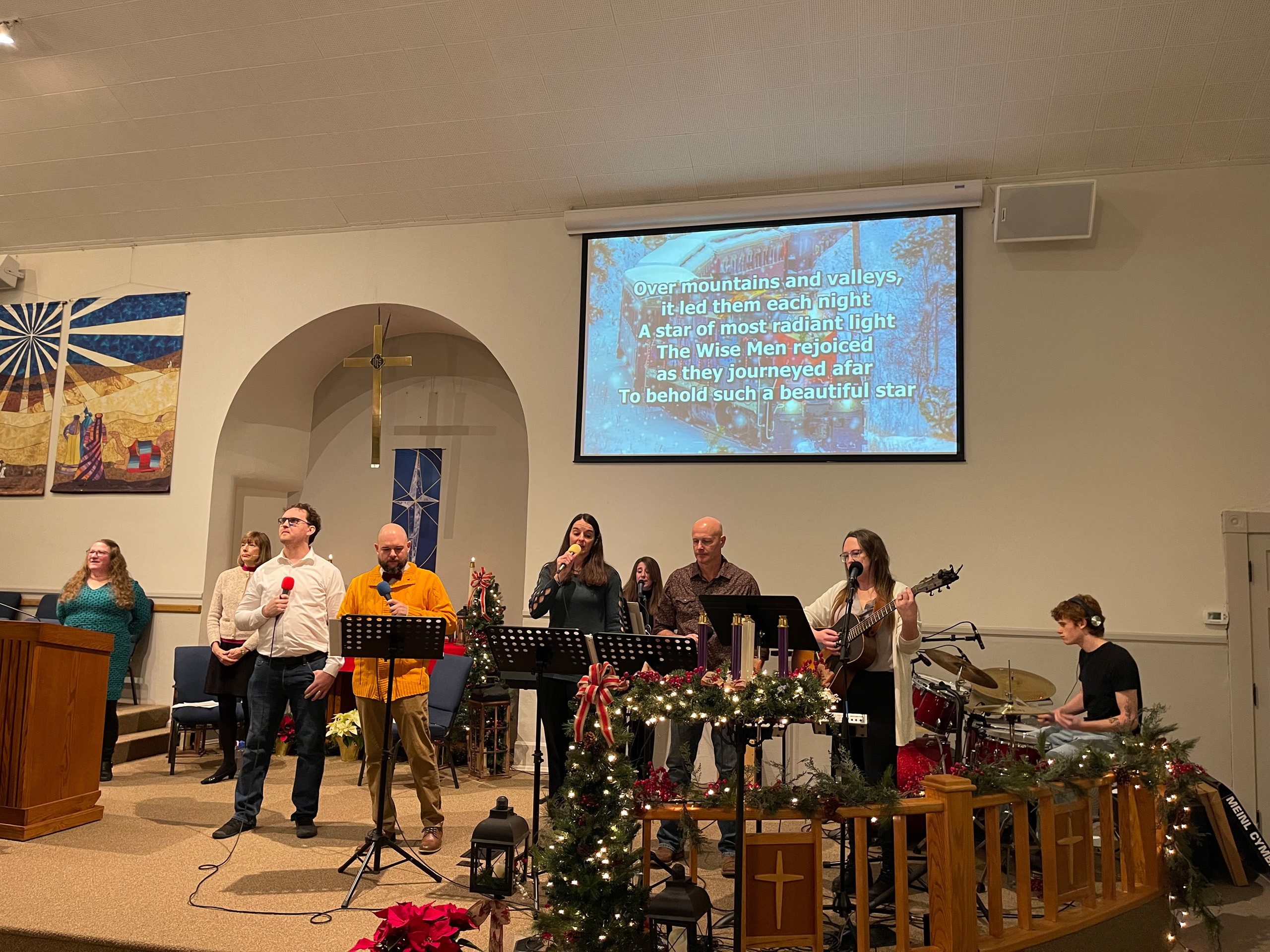 Musicians perform at a holiday church service.
