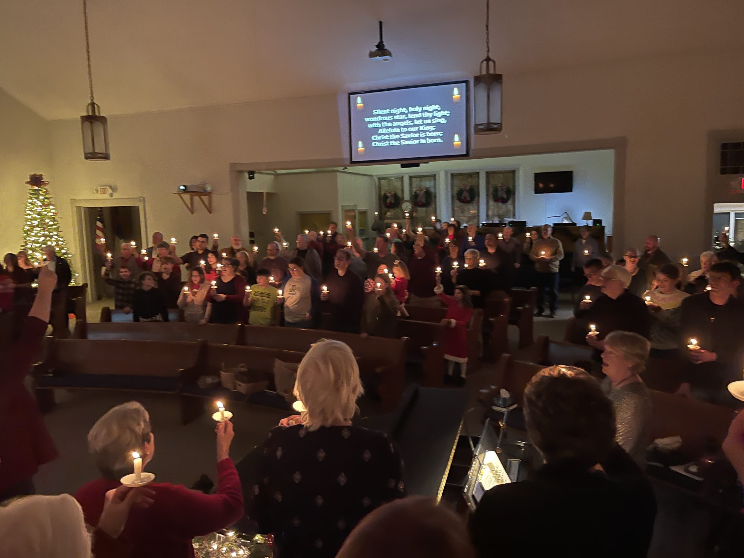Congregation at candlelight service in church